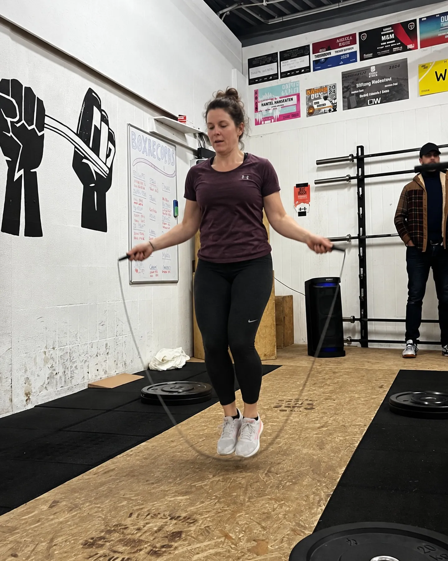 Woman jump-roping on the platform at the Trave CrossFit box